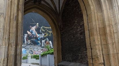 Bristol street art through historical arch