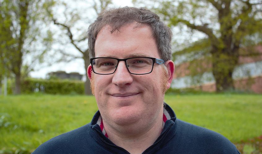 Dr Thom Oliver stands in the grounds of UWE Bristol