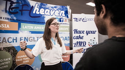 Employer talking to a group of students at an Employers Fair.